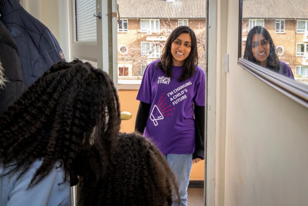 A Home-Start volunteer arriving at a door.